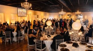 Pizazz Ballroom in amber gold LED lighting for a celebration