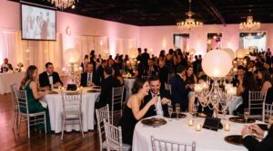 Pizazz Ballroom washed in blush pink LED lighting for a wedding reception